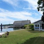 Photo: View of lawn and water at Castine Cottage